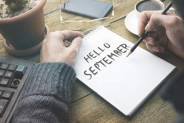 man written hello september text on page © ARAMYAN
