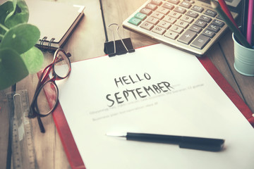 hello september text on paper