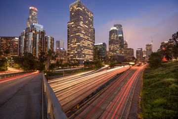 Downtown Los Angeles at night with car traffic light trails