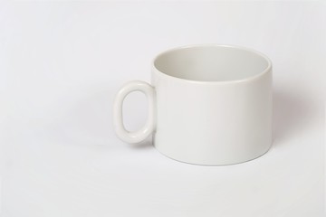 Beautiful white porcelain tea cups on a white background