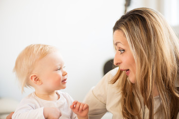 Portrait of beautiful mother and little girl. Family values.