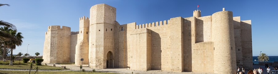 Fototapeta na wymiar walls of old fort in summer day in Tunisia