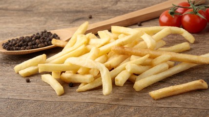 French fries on a wooden background