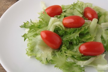 Fresh salad on a wooden background