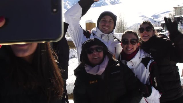 Taking a Selfie of a Family in Valle Nevado, Chile