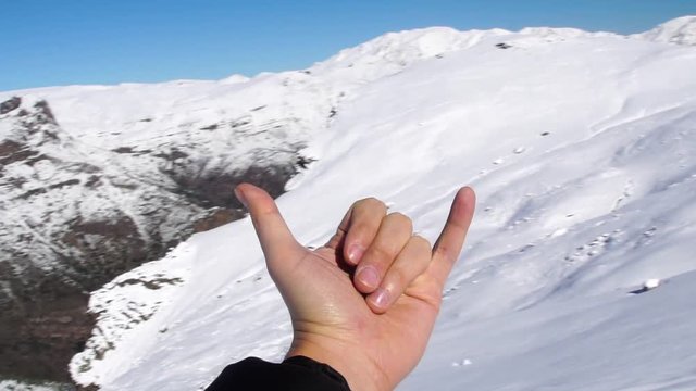 Hand Expressing Positivity on the Top of the Mountain
