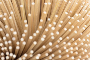 Here are several scattered chopsticks together. Shooting blur at the top. Focus on the deeper part of the picture.