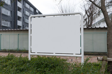 Large blank billboard on a street wall, banners with room to add your own text