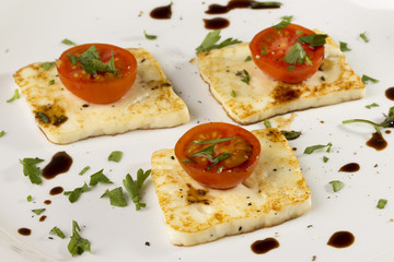 roasted mexican panela cheese whit cherry tomatos, coriander, soy sauce, salt and pepper © raulzvl