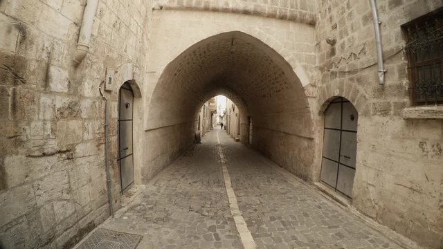 Arche From Overbuilt Passage Under Narrow Ancient Street Paved With Stones in Urfa