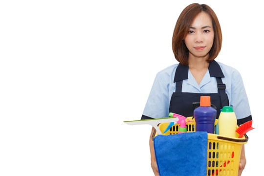 Beautiful Asian maid smile and  holding cleaning equipment in yellow basket on white isolated background with copy space.