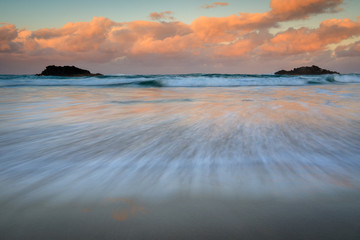 Black rocks at sunset in Pottsville, NSW