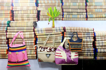 Colorful handcraft made by jute. Different types of bags.