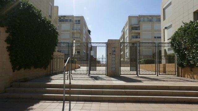 The leaning building in Acre Akko , Israel is imploded after the bankrupt builder was required by court to demolish the 15 story building. The building was built illegally and was sinking in the sand