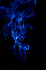 Blue toxic fumes movement on a black background.