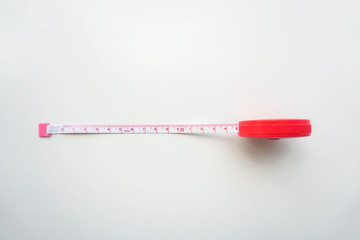 isolate pull measurement tape from the pink red roll