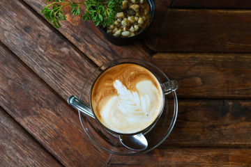 Top view of Hazelnut Latte Coffee on wooden table
