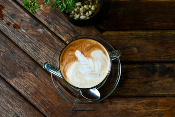 Cup of Latte coffee on wooden table