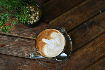 Cup of Latte coffee on wooden table