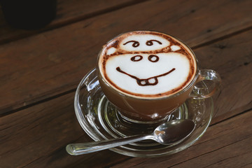 Cup of mocca coffee on wooden table