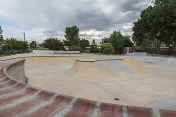 pool style coping on a bowl at a skate park