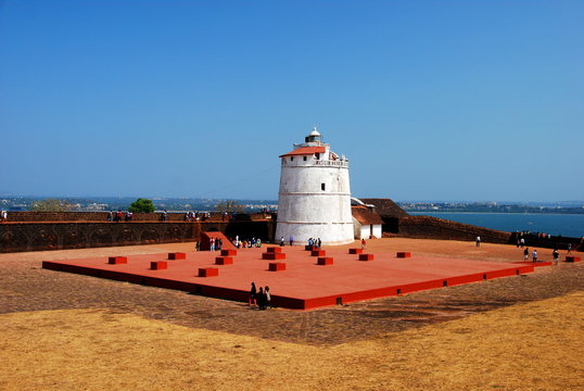 The lighthouse of the Aguada Fort in Candolim, Goa, India overlooking the Arabian Sea