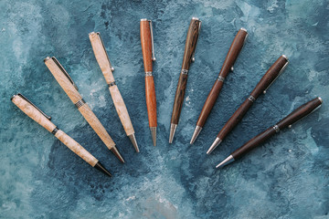 Exclusive pen on wood background