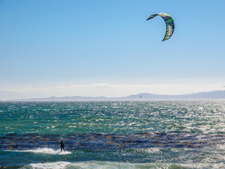 Kite surfer in action on a windy day