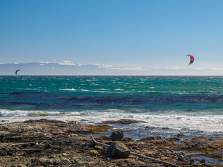 Kite surfers in action on a windy day