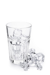 Glass with ice cubes. Isolated on white background