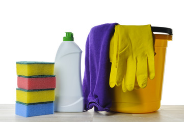 Cleaners, sponges, rags and rubber gloves on a white background