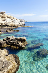 Fototapeta na wymiar Turquoise waters of Mediterranean sea with cliffs and rocks