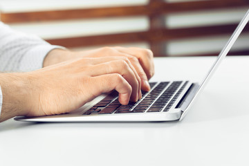 Businessman working on laptop. On the table