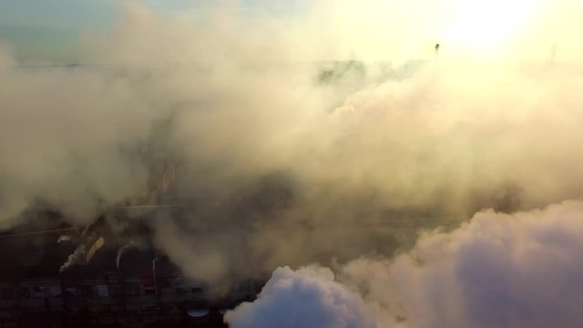 Drone aerial fly above chemical factory smoke.