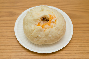 traditional Chinese bun on a wood table