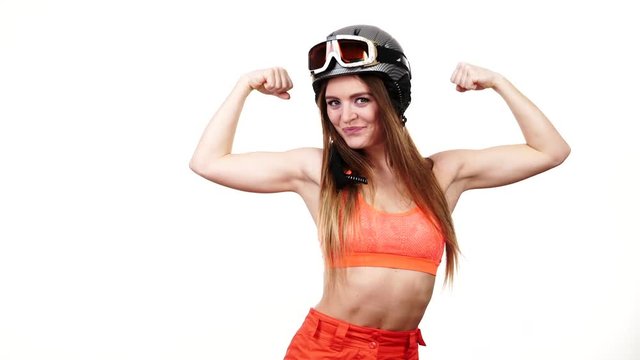 Woman skier preparing for season. Happy fit girl in skiing gear presenting muscles. Winter sport activity, healthy leisure concept. Slim strong sportswoman on white, studio shot, full HD
