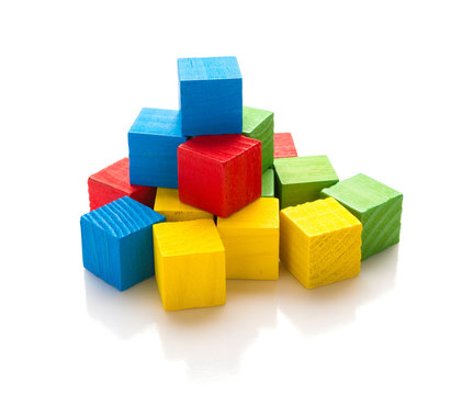 colorful square wooden toy blocks on a white background