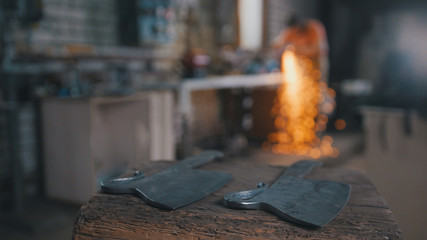 Blacksmith workshop - grinding iron knifes with sparkles