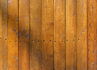 Background of wooden boards brown color with the nails.