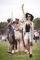 Group of friends dancing at the festival