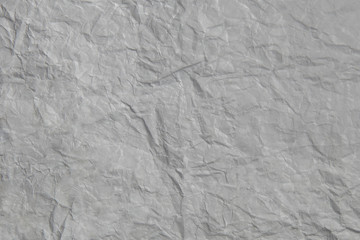 Grey sheet of paper crumpled, texture background