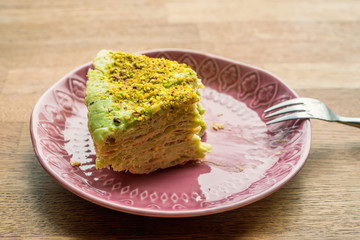Unfinished piece of puff cake on plate