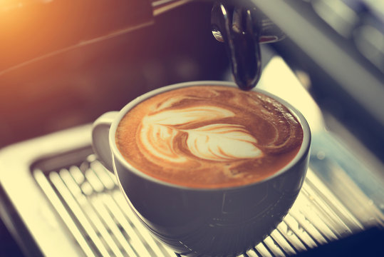 how to make latte art by barista focus in milk and coffee in vintage color