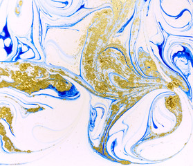 Marbled blue, white and gold abstract background. Liquid marble pattern.