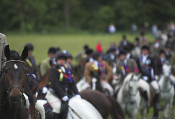 Selkirk Common Riding cavalcade follwoing the Standard Bearers riding up to linglie Farm