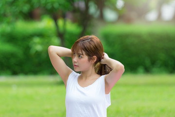 Closeup of women doing yoga in park