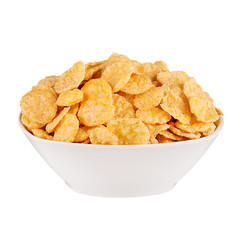Golden corn flakes in white bowl isolated on white background. Cereals.