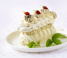 meringue cake with fresh berries on white background