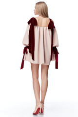 Sexy pretty fashion model blond hair woman wear style for party office clothes organic natural beige dress white background makeup lady perfect body shape shop magazine cover catalog collection.