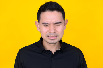Fototapeta premium A man expressing very sad and disappointed feeling